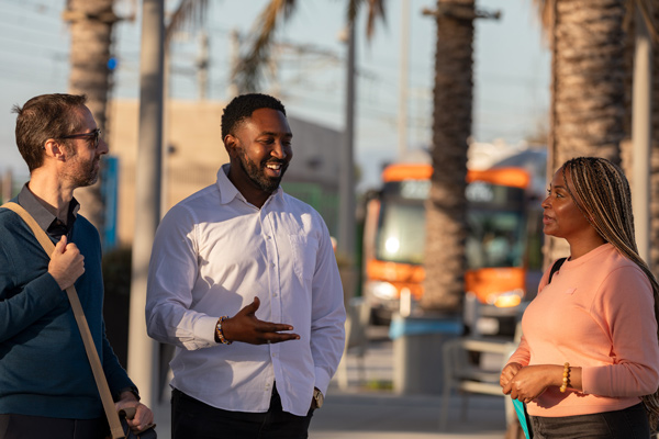 People talking waiting for a bus