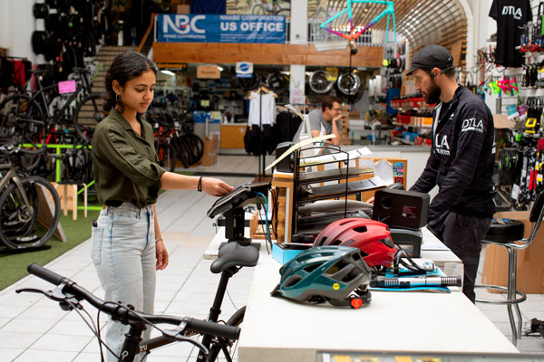 A woman in a bike shop.