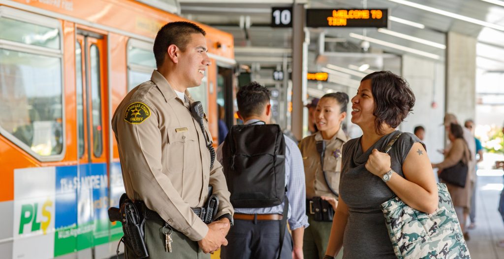 Security officer talking with female rider