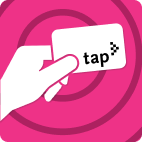 Hand holding TAP card on light magenta striped background.